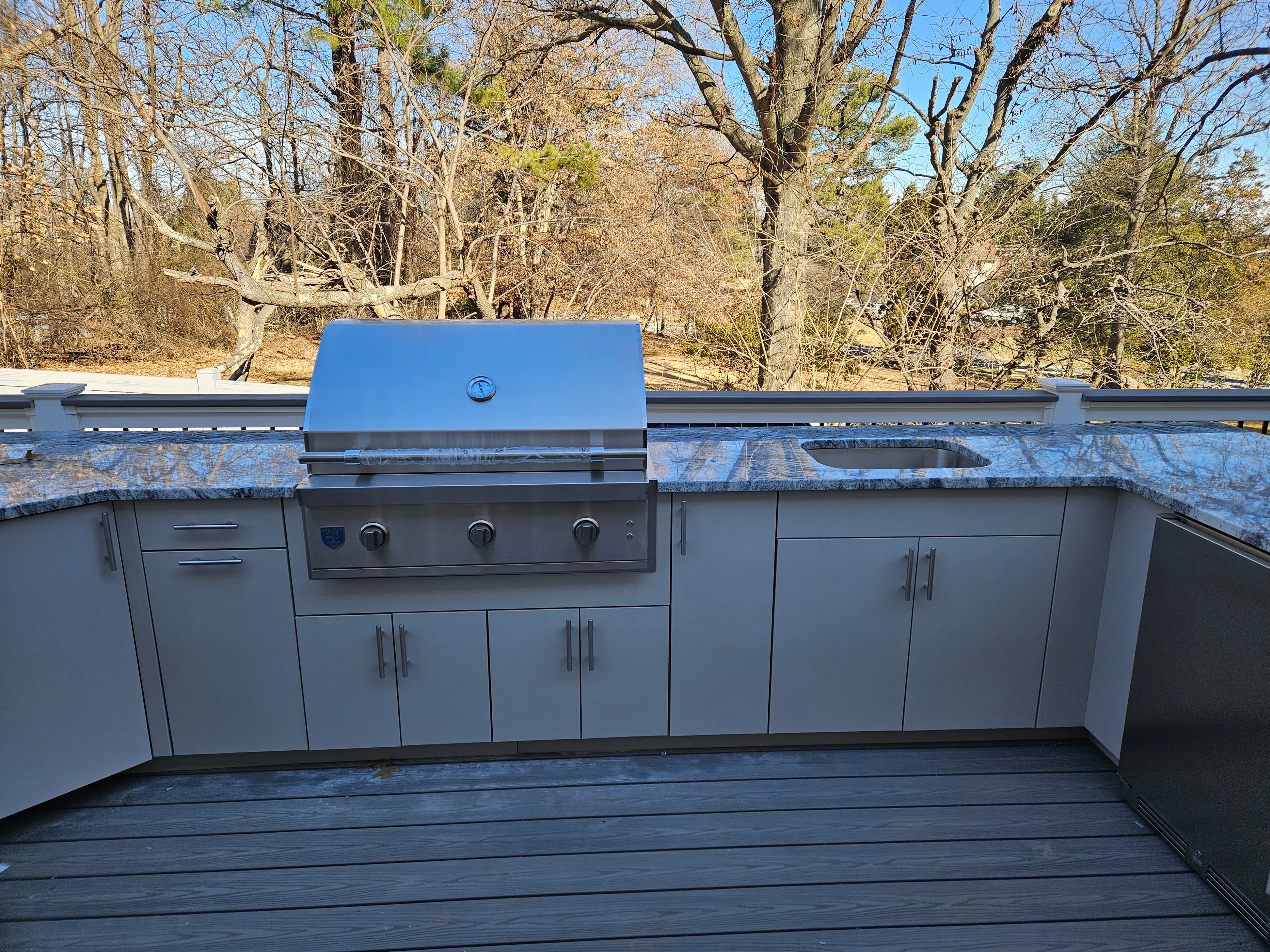 Completed installation — full U-shaped outdoor kitchen view